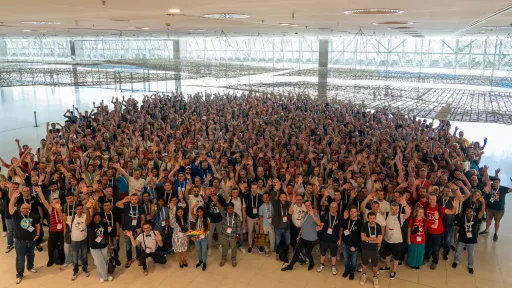 Large group of people at DrupalCon Barcelona 2024 posting for a group photo.